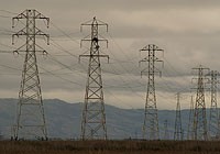 Power-line towers across a valley